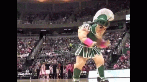 Spartan Mascot Dancing on Court in Front of Crowd