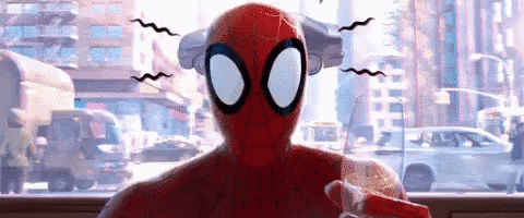 Spider-Man Is Sitting In Front Of A Window With A City In The Background And A Car In The Background . GIF