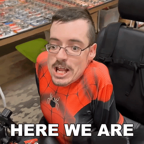 Spiderman Costume In Wheelchair Says Here We Are GIF