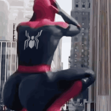 Spiderman Squatting in Front of City Building