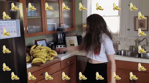 Spinning Banana Girl Saying Bananas GIF