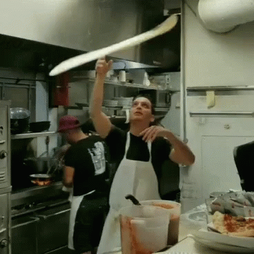 Spinning Dough Pizza In The Kitchen GIF