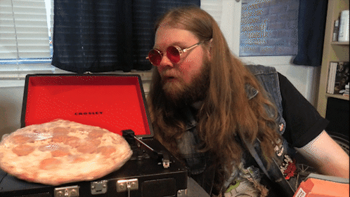 Spinning Pizza On The Music Plate GIF