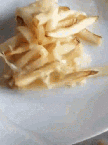 Spinning Plates With Potato Fries GIF