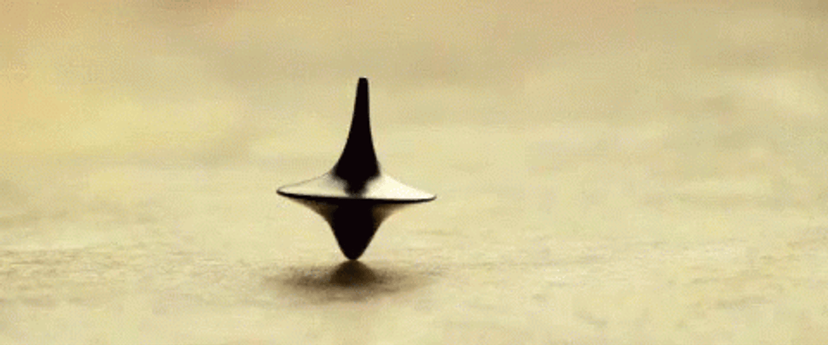 Spinning Totem On The Floor In Inception GIF