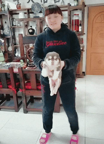 Spinning Woman Carrying A Dog GIF