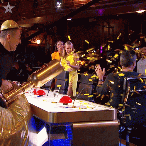 Splashing The Confetti Cannon To Simon Cowell GIF