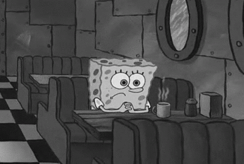 Spongebob Sitting At Diner Table With Coffee GIF