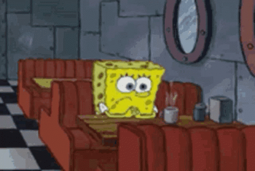 SpongeBob Sitting at Table in Diner With Cup of Coffee