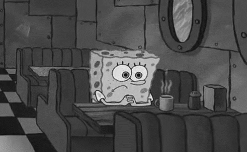 Spongebob Squarepants Is Sitting At A Table In A Diner Holding A Cup Of Coffee . GIF