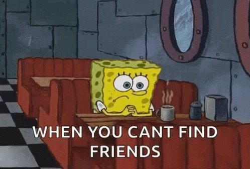 Spongebob Squarepants Is Sitting At A Table With A Cup Of Coffee . GIF