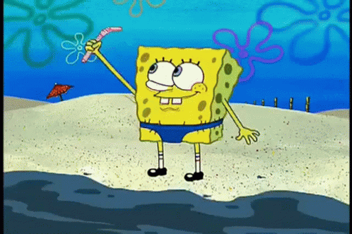 Spongebob Squarepants Is Standing On The Beach Holding A Worm In His Hand . GIF