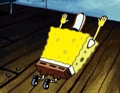 Spongebob Squarepants Laying On Wooden Floor With Hands Up GIF