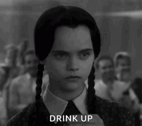 Spooky Wednesday Addams Drinking GIF