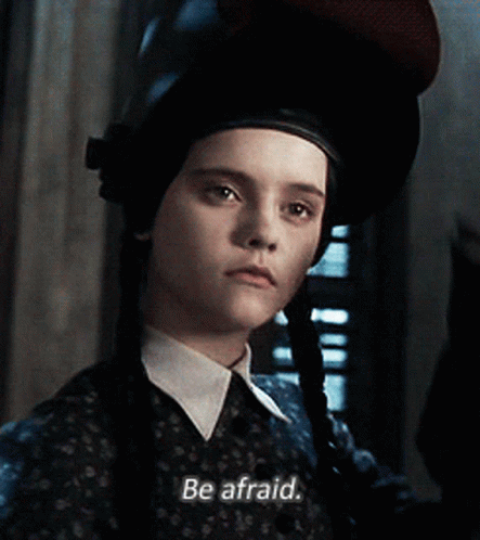 Spooky Wednesday Addams In Cap GIF