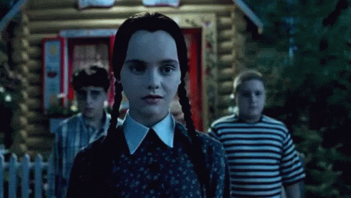Spooky Wednesday Addams Smiling GIF