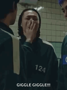 Squid Game Man Covering Mouth Laughing GIF