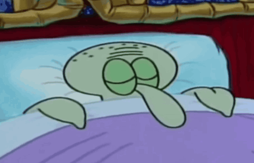 Squidward From Spongebob Squarepants Is Laying In Bed GIF
