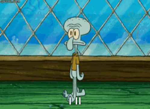 Squidward Standing In Front Of Chain Link Fence