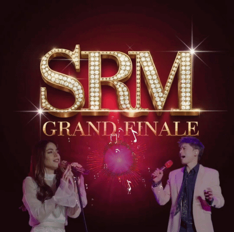 SRM Grand Finale Man And Woman Singing Into Microphones GIF