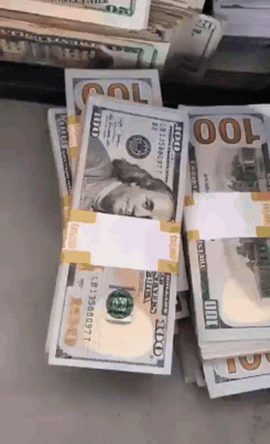 Stack Of 100 Dollar Bills With Benjamin Franklin GIF