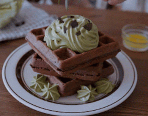 Stack of Chocolate Waffles With Green Frosting and Chocolate Chips