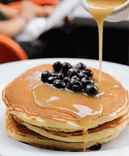 Stack of Pancakes With Blueberries and Syrup