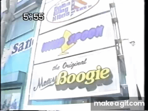 Stack of Signs on Building Saying The Original Boogie