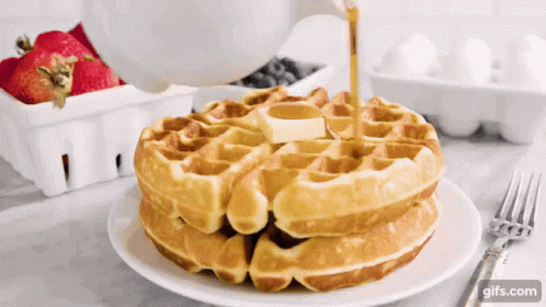 Stack Of Waffles With Syrup Being Poured GIF