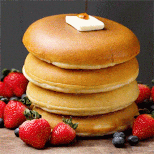 Stacked Pancakes with Syrup and Butter