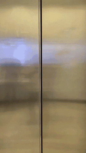 Stainless Steel Refrigerator With Red Sticker Saying Ba Don't Fame