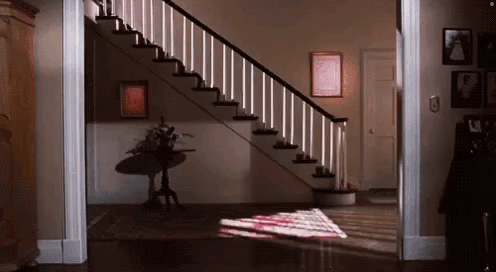Staircase With Table and Wall Pictures