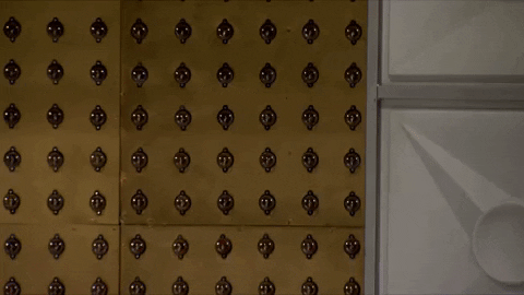 Stalking Lady Creeping Behind Wall GIF