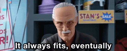 Stan Lee Says It Always Fits Eventually In Front Of A Sign For Stan 'S Sale Collectibles GIF