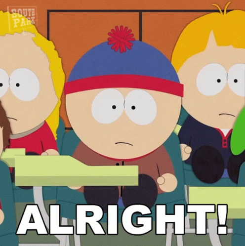 Stan Marsh From South Park Sits At A Desk In A Classroom With Other Students GIF