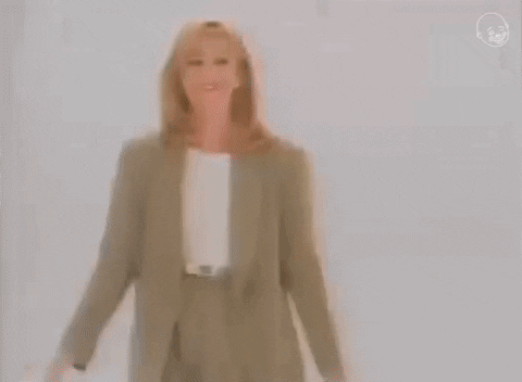 Stand Up Woman In Formal Outfit GIF