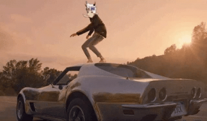 Standing Above The Running Race Car GIF