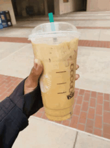 Running With Starbucks Coffee On Hand GIF