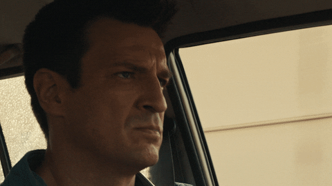 Stare Down Nathan Fillion Intense Face GIF