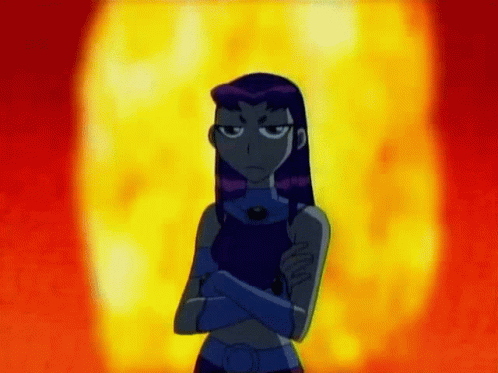 Starfire From The Teen Titans Go Is Standing In Front Of A Fireball With Her Arms Crossed . GIF