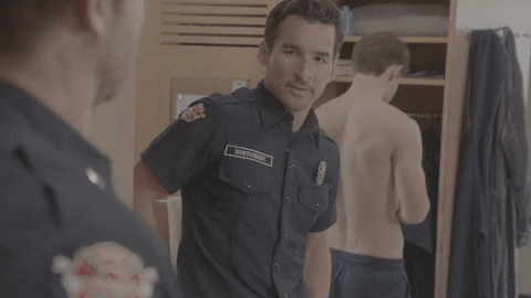 Station 19 Travis Montgomery Looking At Text Message GIF