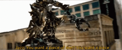 Statue In Front Of Building Saying Jazz You Want A Piece Of Me GIF