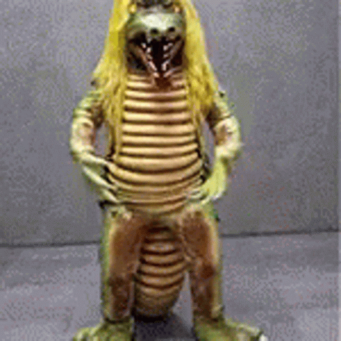 Statue of Dinosaur With Long Blonde Hair