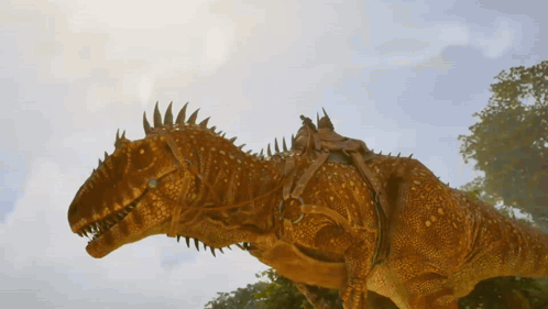 Statue Of Dinosaur With Person Riding It GIF