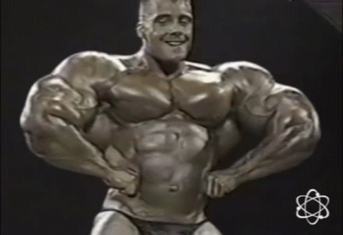 Statue Of Man With Huge Muscles And Small Atom GIF