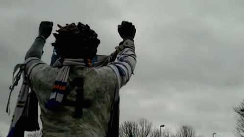 Statue Of Man With Scarf And Number 4 On Back GIF