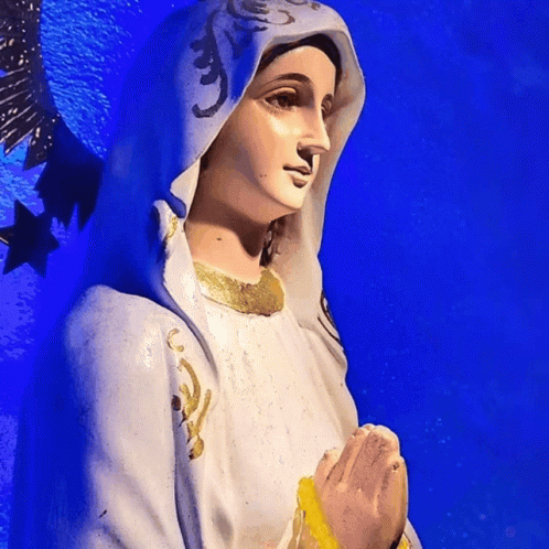Statue Of Woman In White Robe And Blue Cape GIF