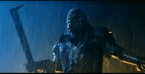 Statue Standing In Rain With Arm Outstretched GIF