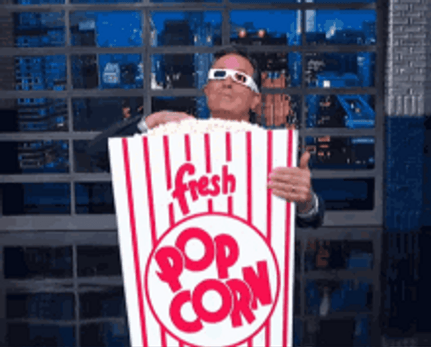 Steven Colbert Holding Giant Popcorn Meme GIF