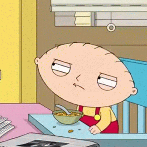 Stewie From Family Guy Is Sitting At A Table Eating Cereal . GIF